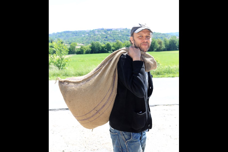 Fabrice with a sack of freshly picked roses 