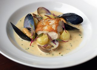 Roast Powell River Sturgeon Chowder with Manilla Clams, Island Mussels, Fondant Potato, Fennel and T