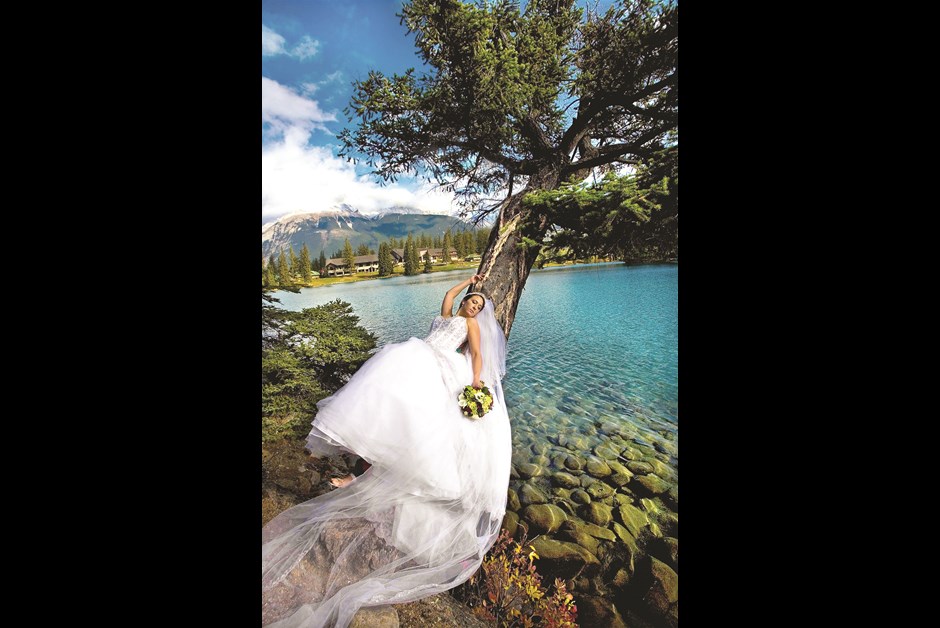 Maru Photography captures a bride from across Lac Beauvert.