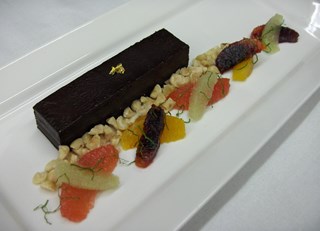 Chocolate Tart with Citrus Salad and Crushed Hazelnuts