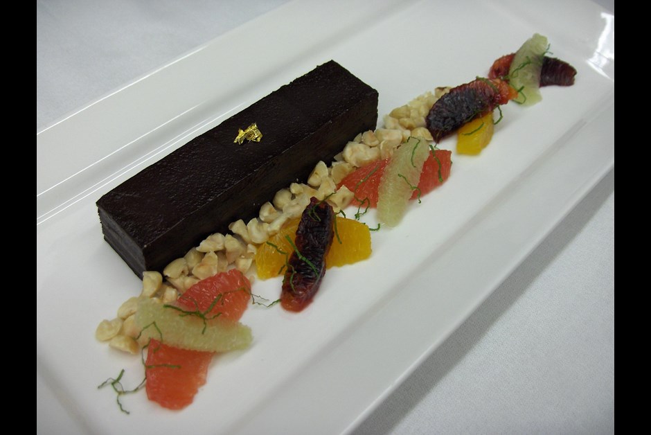 Chocolate Tart with Citrus Salad and Crushed Hazelnuts