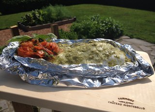 Wrapped pike filet with garden herbs, tomato & basil mash