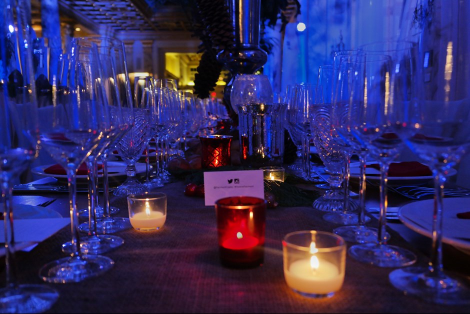 Farm tables were lined with festive, holiday decor and twinkling candles