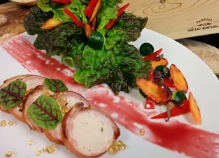 Red spring lettuce with vegetables, rabbit saddle rolled in crispy bacon and maple caviar