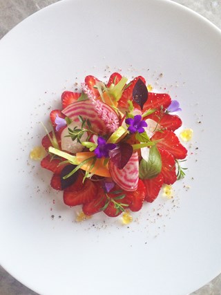 Honey glazed scallops with strawberries and chef's garden herbs salad
