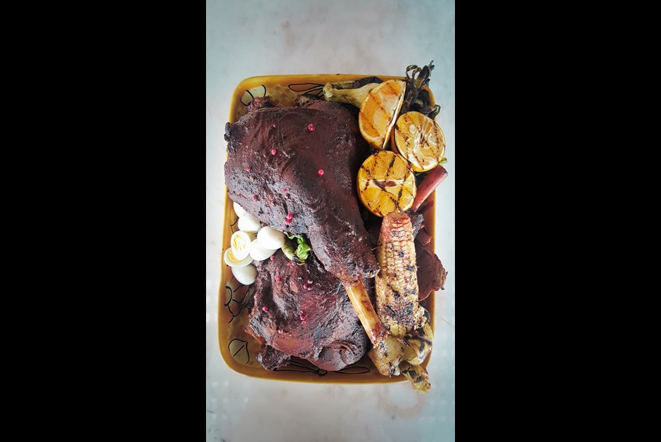 Chilhuacle rubbed leg of lamb, grilled corn on the cob and baby onions