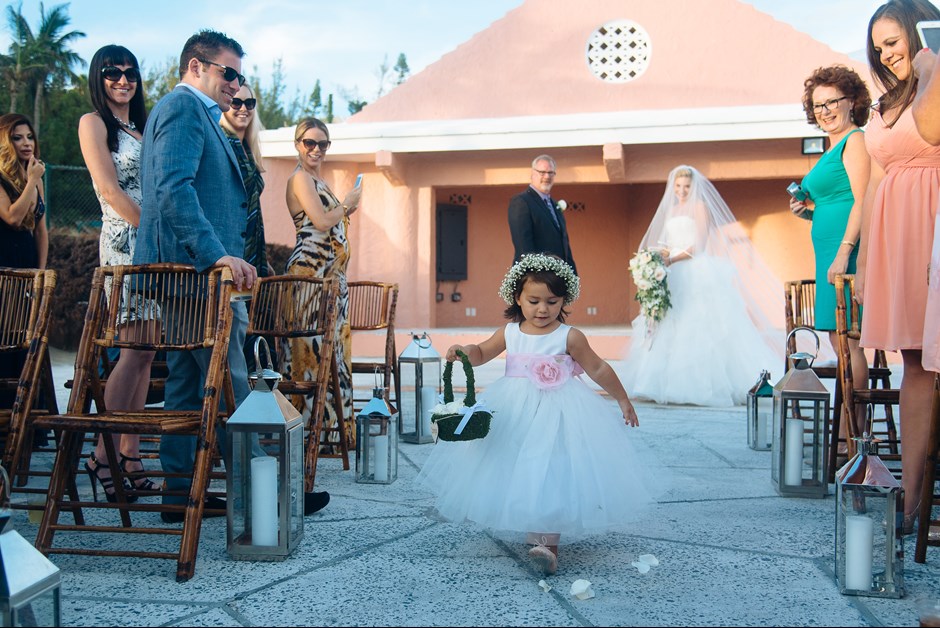 Flower girl at the ceremony on the beach