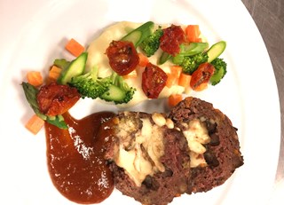 Mini meatloaf stuffed with cheese curds, homemade plum and apricot BBQ sauce