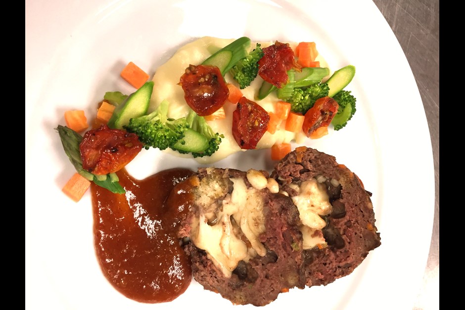 Mini meatloaf stuffed with cheese curds, homemade plum and apricot BBQ sauce